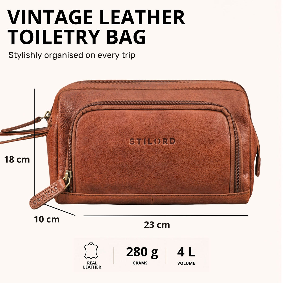 Necessaire em couro cor maraska castanho, vista frontal com fecho, logótipo STILORD em relevo e pega